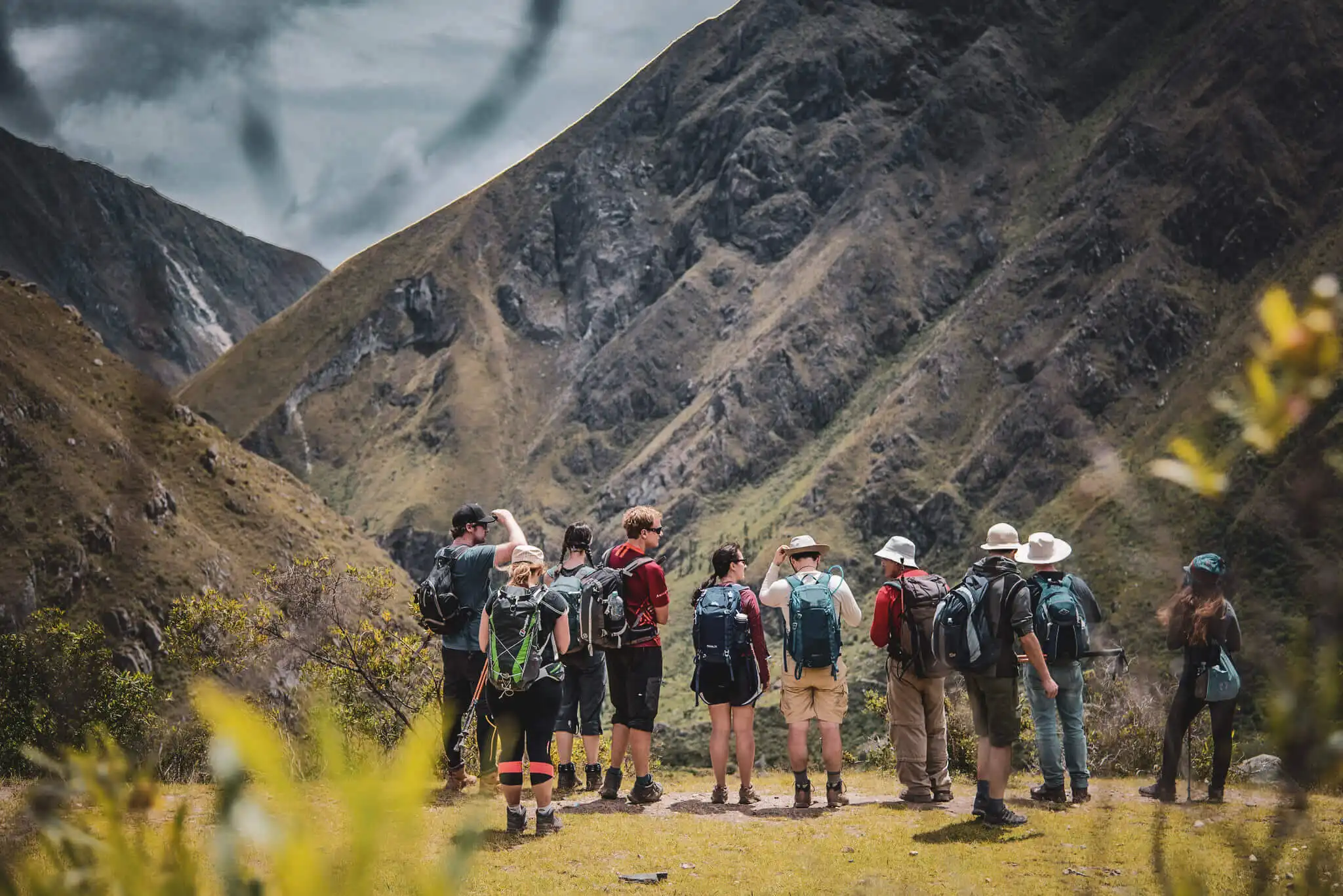 A group of hikers pausing in a high Andean valley on the Classic Inca Trail