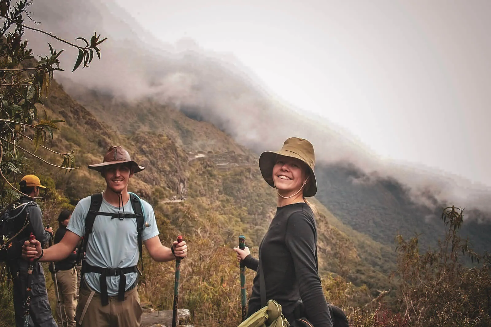 Hikers walking through changing cloud conditions on the Inca Trail