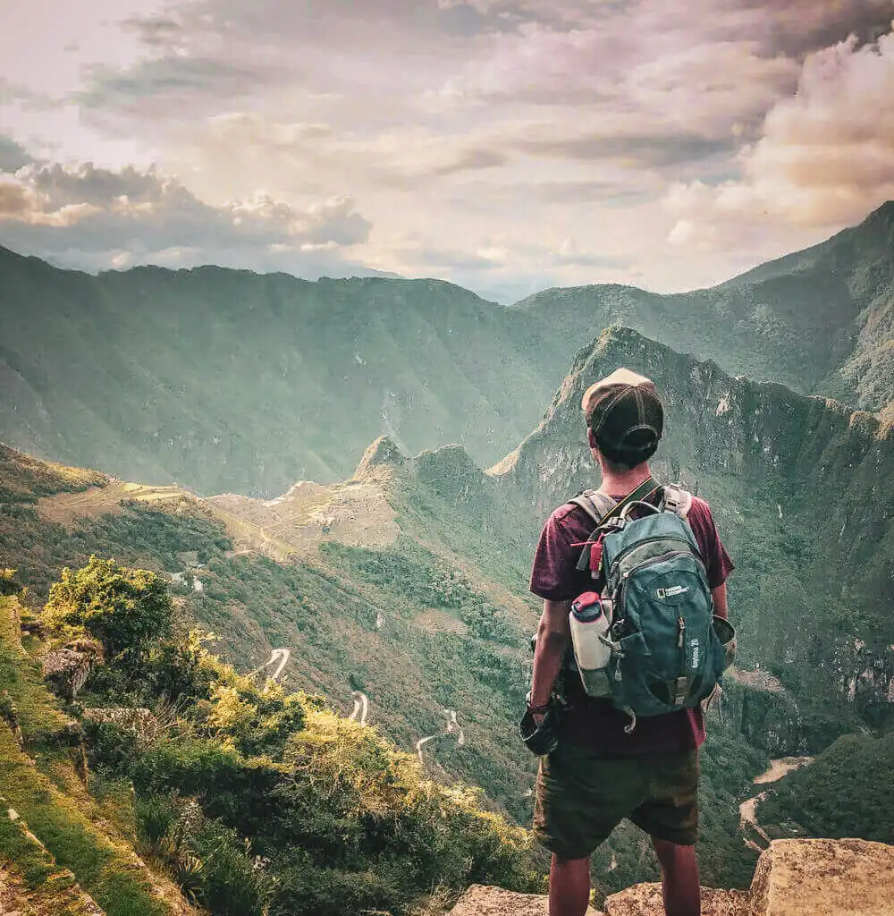 Hikers following a steep green section of the Short Inca Trail